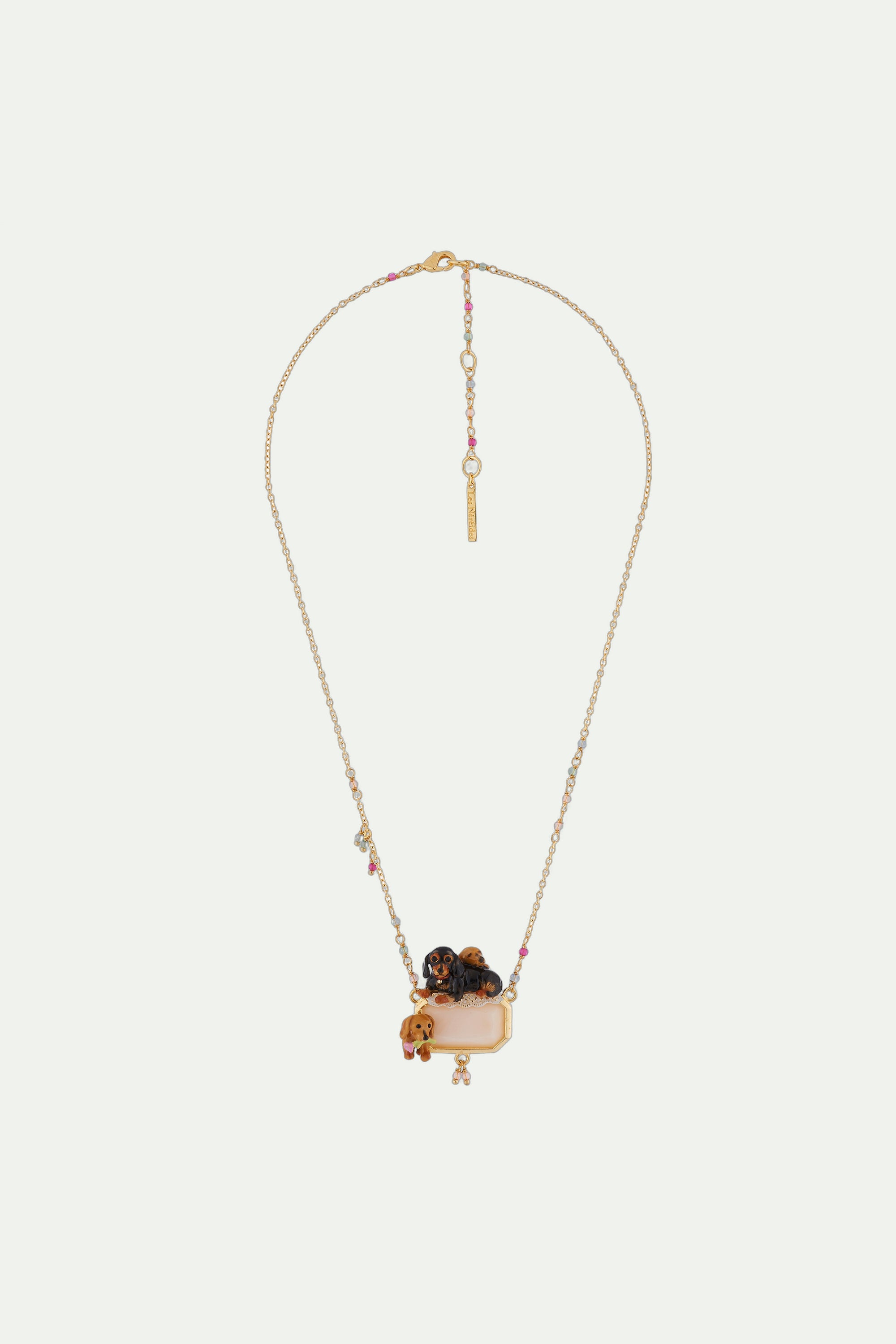Necklace with family of dachshunds on rectangular faceted crystal