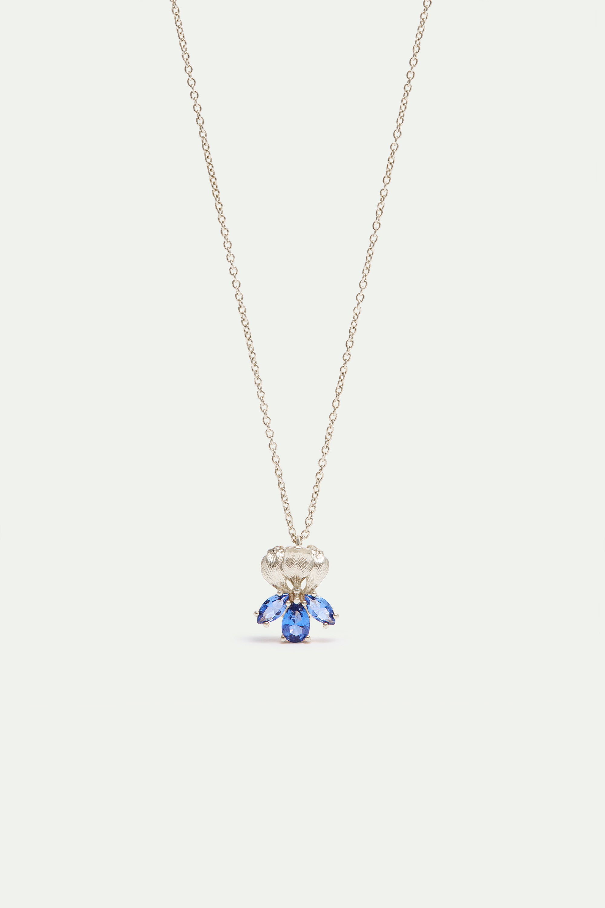 Silver iris flower and blue stone pendant necklace
