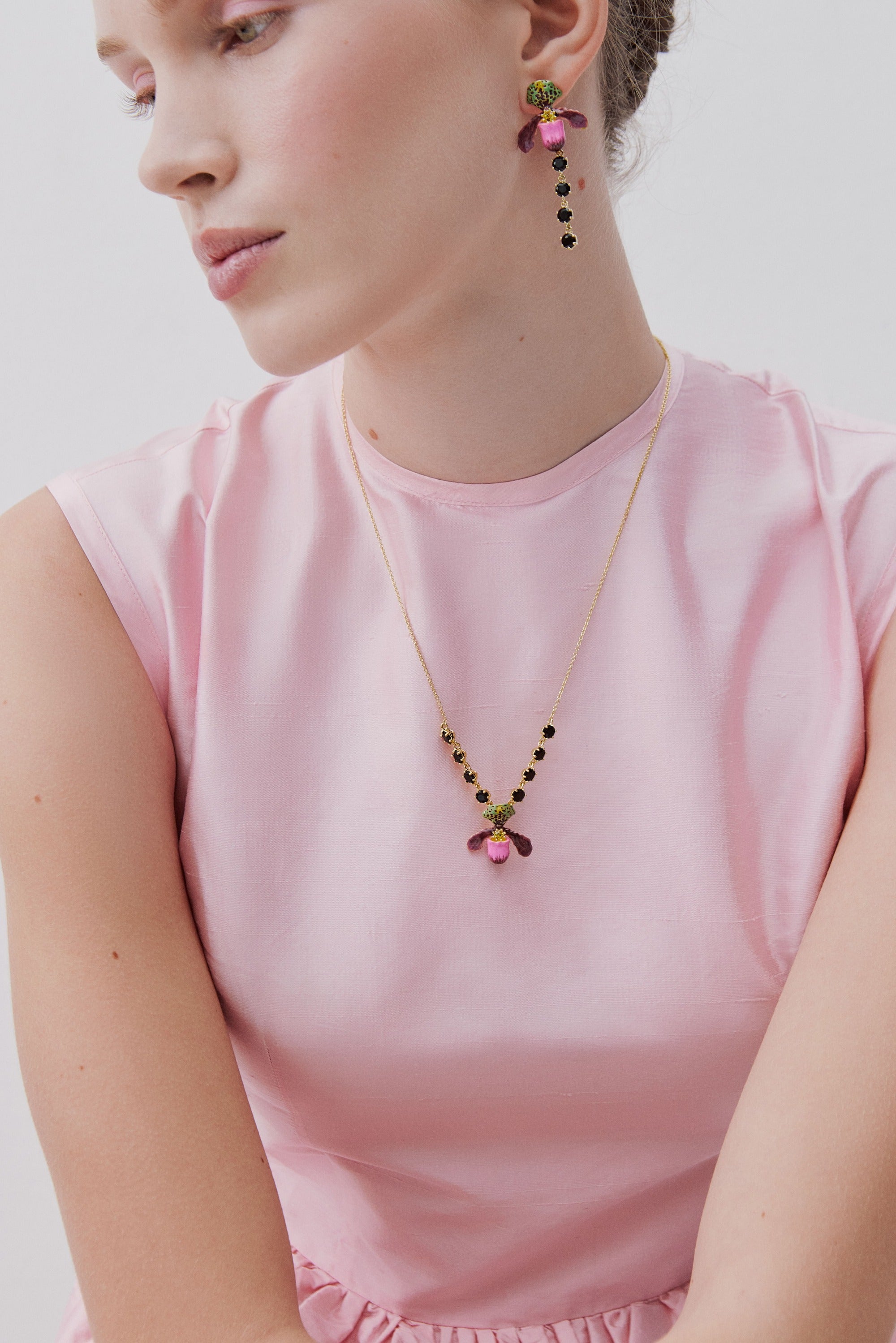 Purple lady's slipper orchid necklace with black faceted glass stones