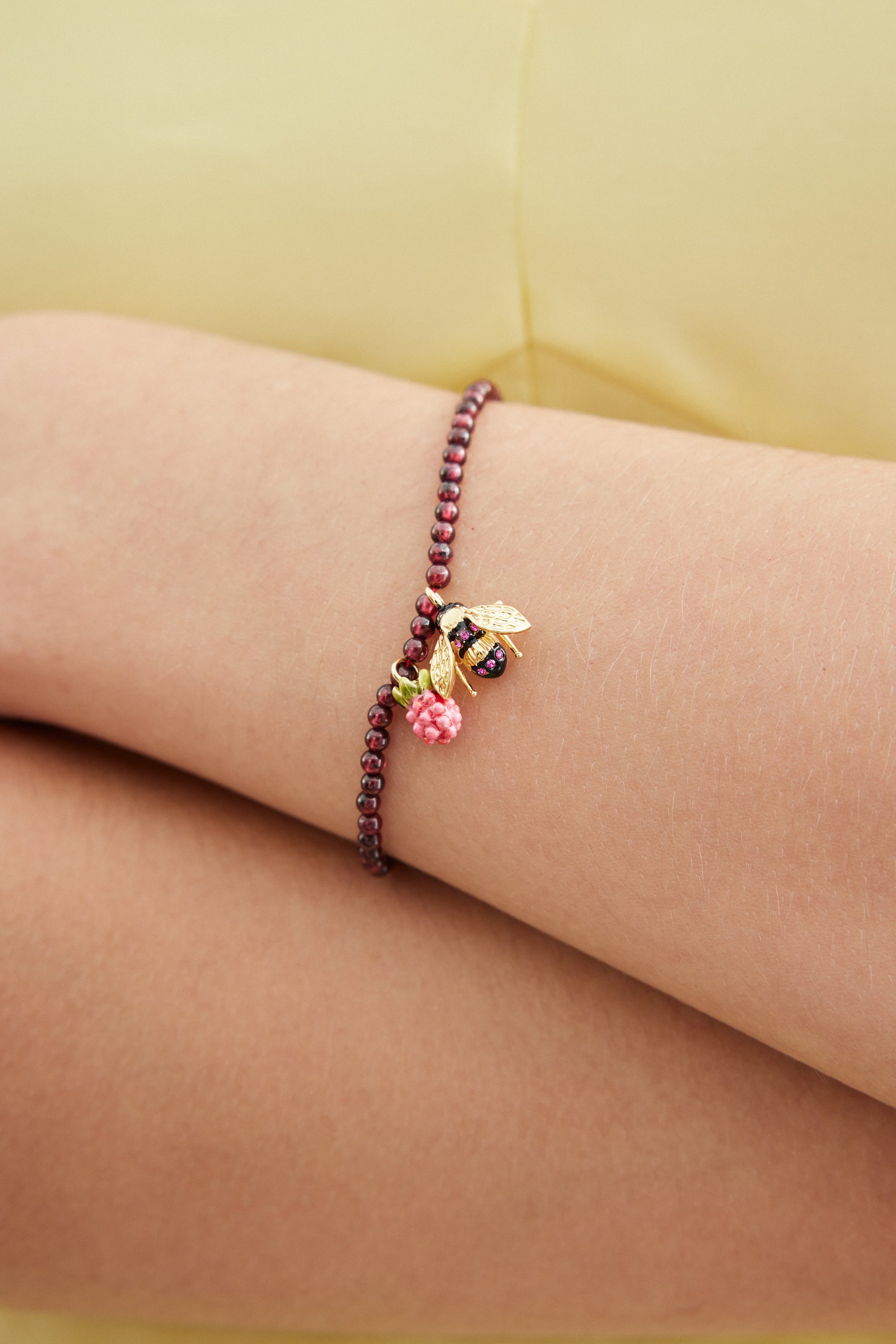 Reconstituted garnet bead bracelet with bee and raspberry