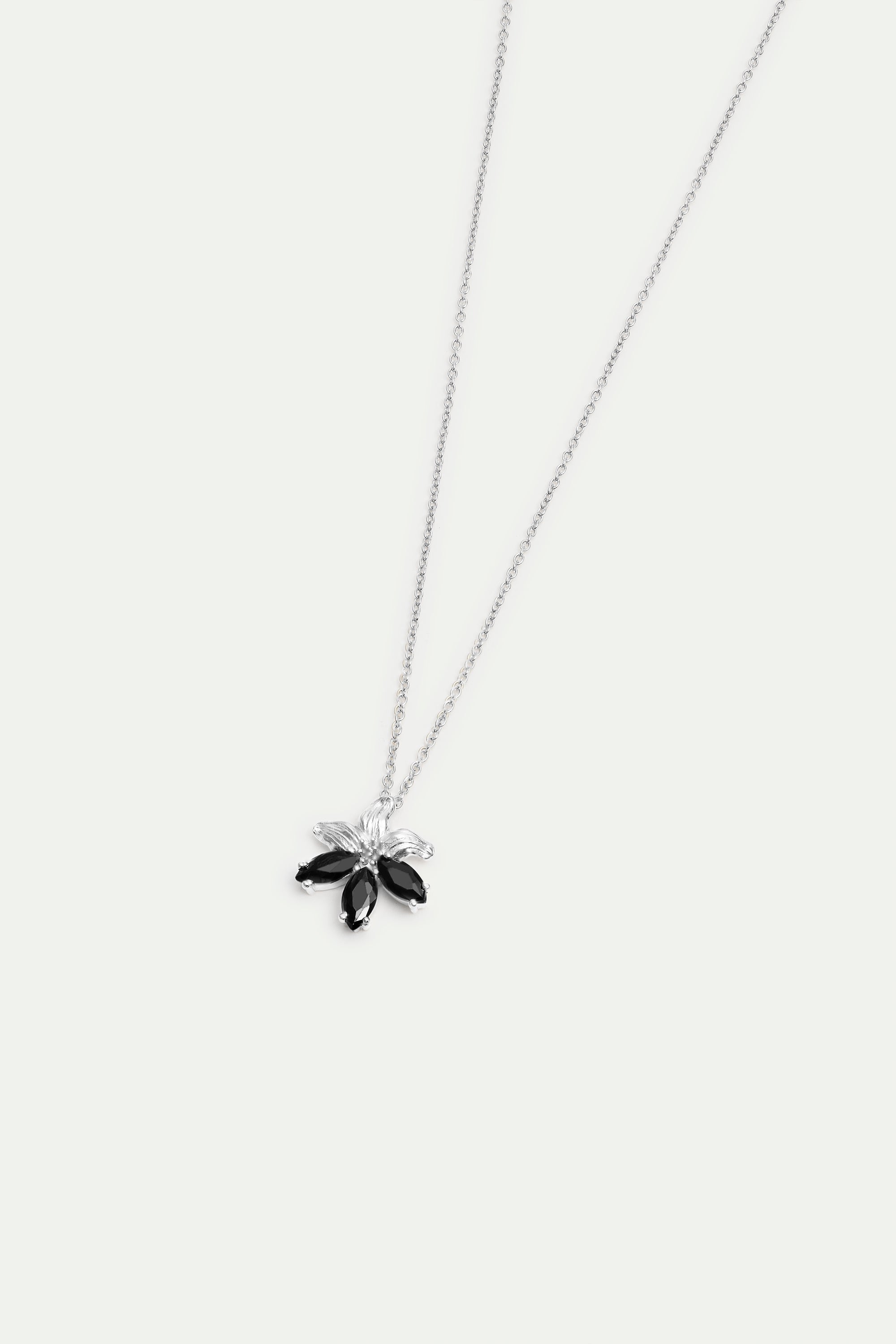 Silver lily and black stone pendant necklace