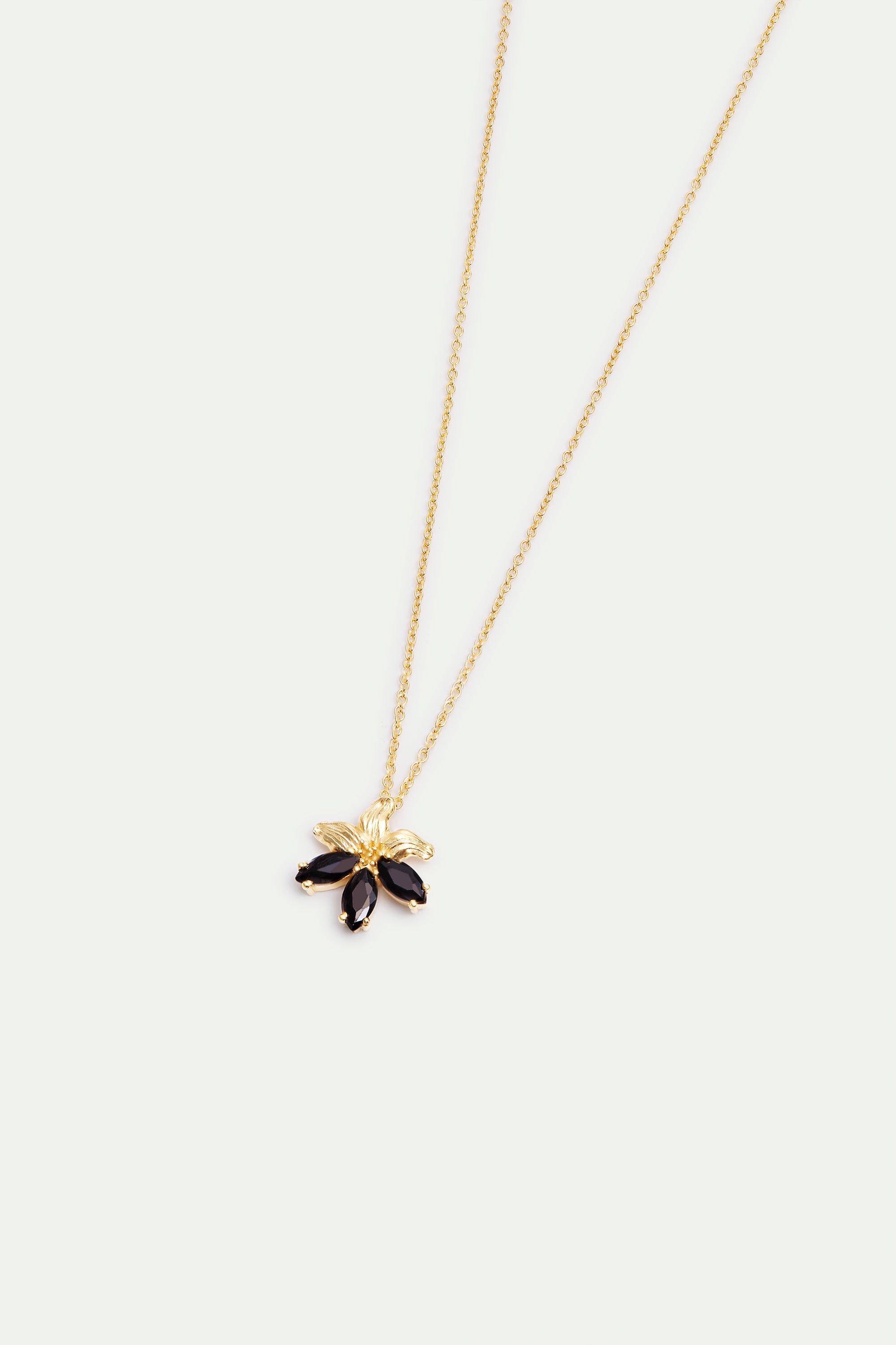 Gold lily and black stone pendant necklace